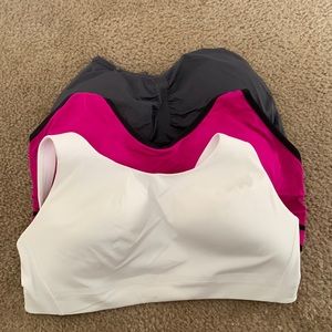 sports bra. White one is size 36c the grey is size xl and pink is size xxxl
